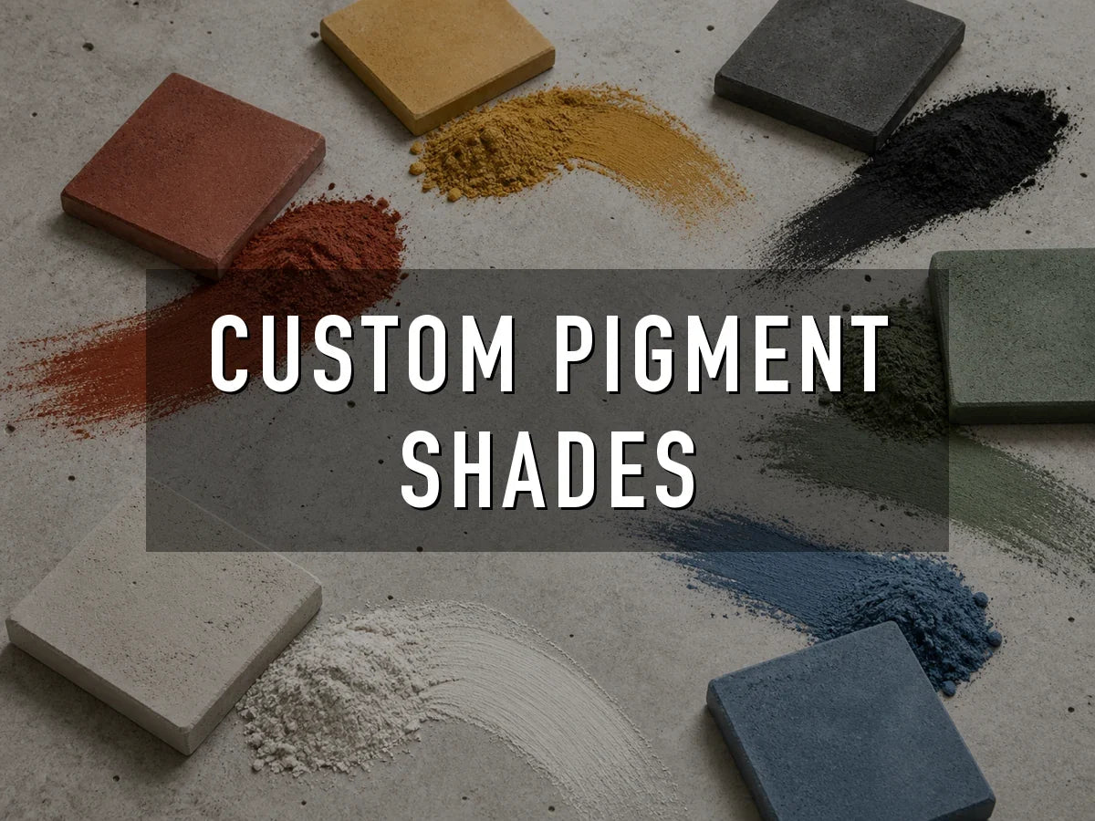 Red, yellow, black, green, white and blue concrete pigment powders swept across a concrete surface beside pavers cast in the matching colors, titled “Custom Pigment Shades”