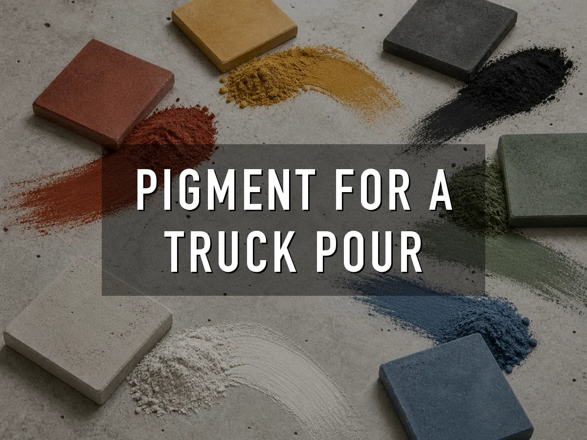Red, yellow, black, green, white and blue concrete pigment powders swept across a concrete surface beside pavers cast in the matching colors, titled “Pigment for a Truck Pour”
