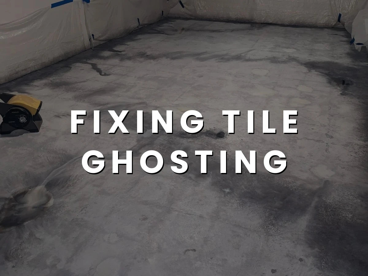 Stained concrete floor showing tile ghosting before sealing