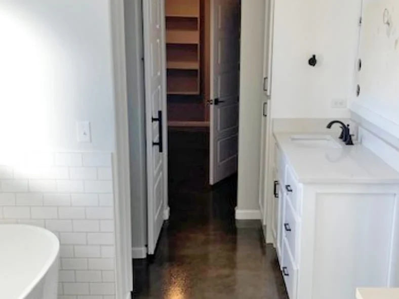 Concrete bathroom floor stained with concrete dye