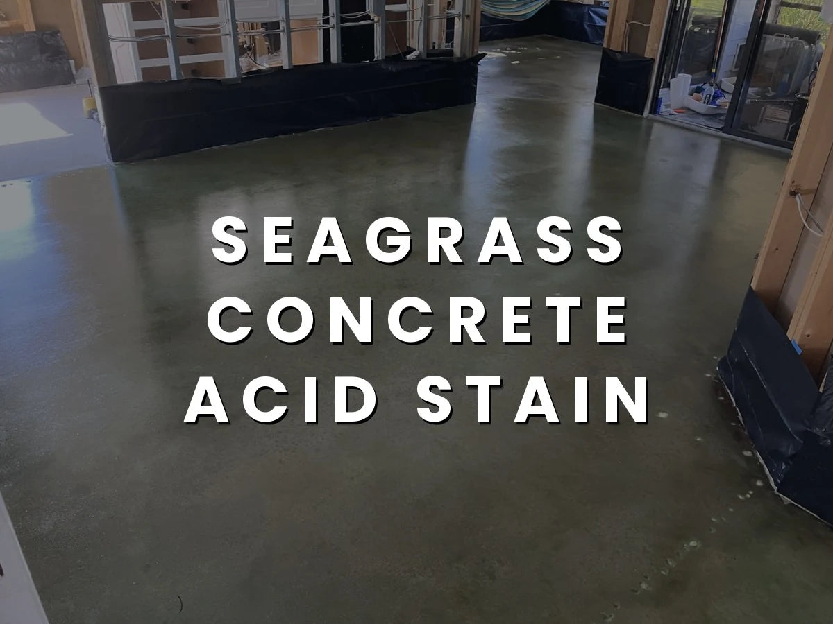 Image of a renovated home interior featuring a beautifully stained concrete floor in hues of Seagrass and Black