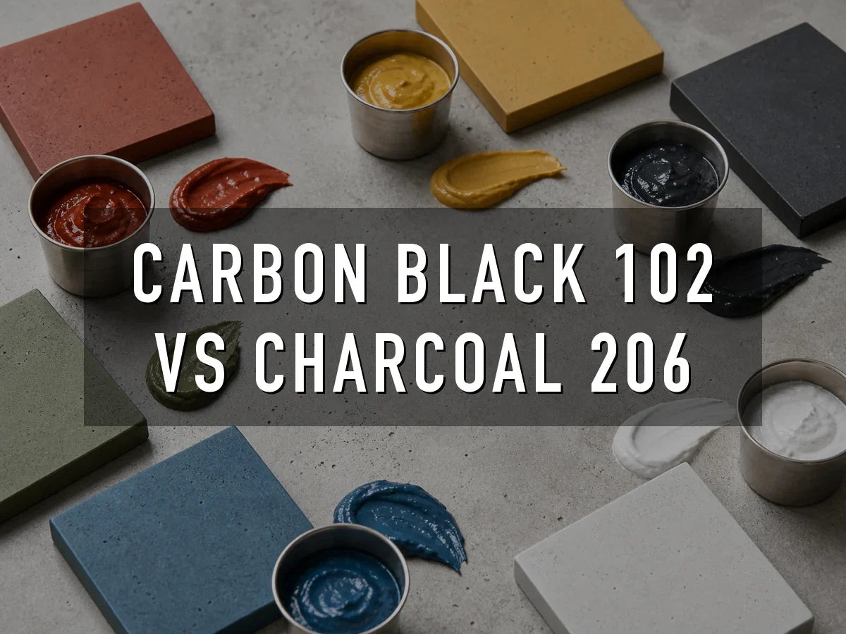 Red, yellow, black, green, blue and white liquid concrete pigment pastes in steel cups, smeared beside pavers cast in the matching colors, titled “Carbon Black 102 vs Charcoal 206”