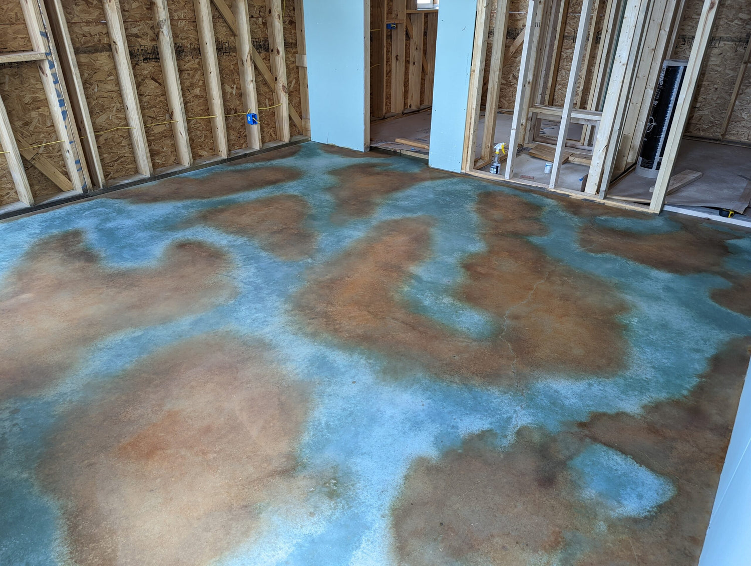 Barndominium casita floor acid-stained in Seagrass and Malayan Buff EverStain