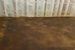 Acid-stained floor treated with neutralizer, before the final rinse and cleaning