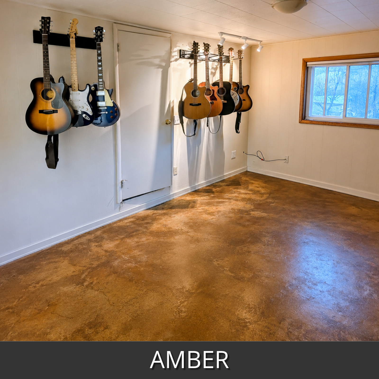 A room with a stained concrete floor in an amber colorwave color, showing several guitars hanging on wall racks against white walls.