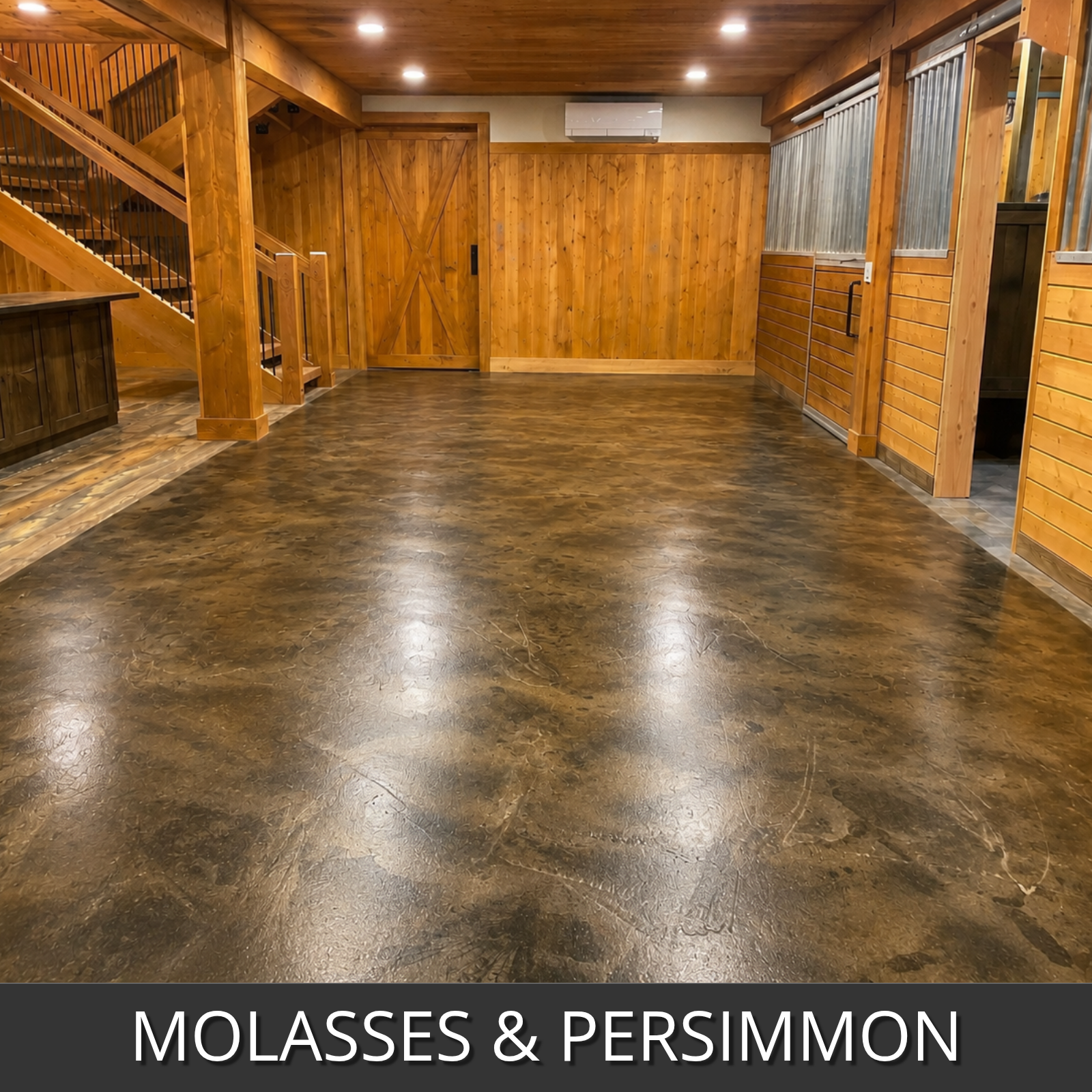 A large barn style space with polished dark brown and black marble-look flooring done with molasses and persimmon colorwave colors, wood-paneled walls, wooden doors, and a staircase on the left
