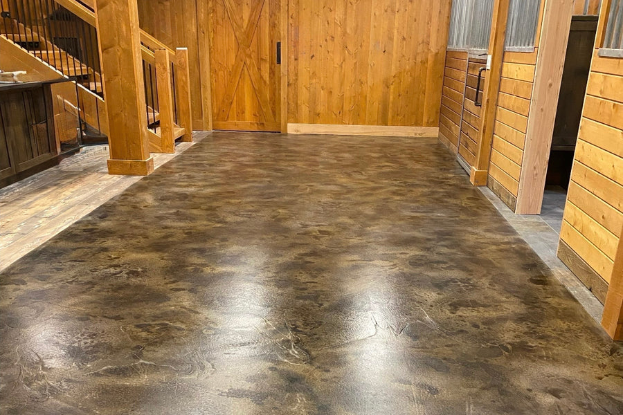 Barndominium concrete floor stained with ColorWave Persimmon, Molasses, and Steel for a worn leather look