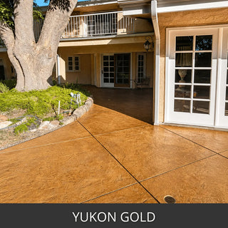 Stained concrete walkway and patio at a set of French doors, Antiquing™ Stamped Concrete Stain in 430 Yukon Gold