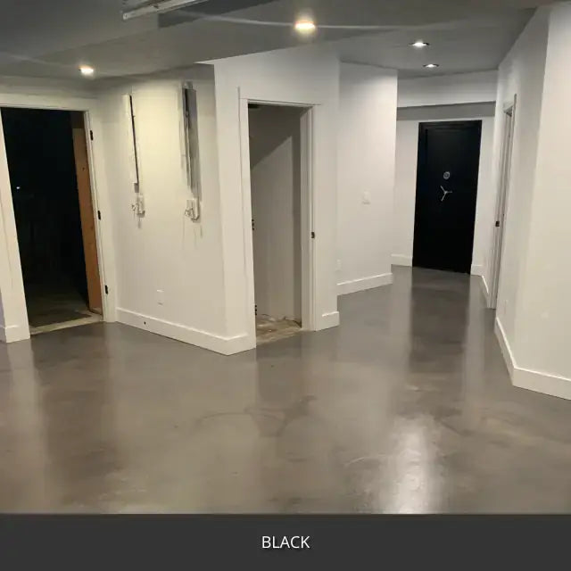 Sealed concrete floor in a finished basement hallway, AcquaTint™ PRO Colored Sealer in 503 Black