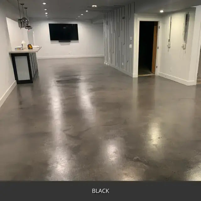 Sealed concrete floor in a finished basement living area, AcquaTint™ PRO Colored Sealer in 503 Black