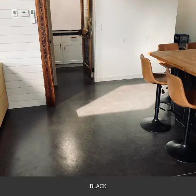 Sealed concrete floor in a kitchen and dining area, AcquaTint™ PRO Colored Sealer in 503 Black