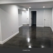 Sealed concrete floor in an empty finished basement, AcquaTint™ PRO Colored Sealer in 506 Charcoal