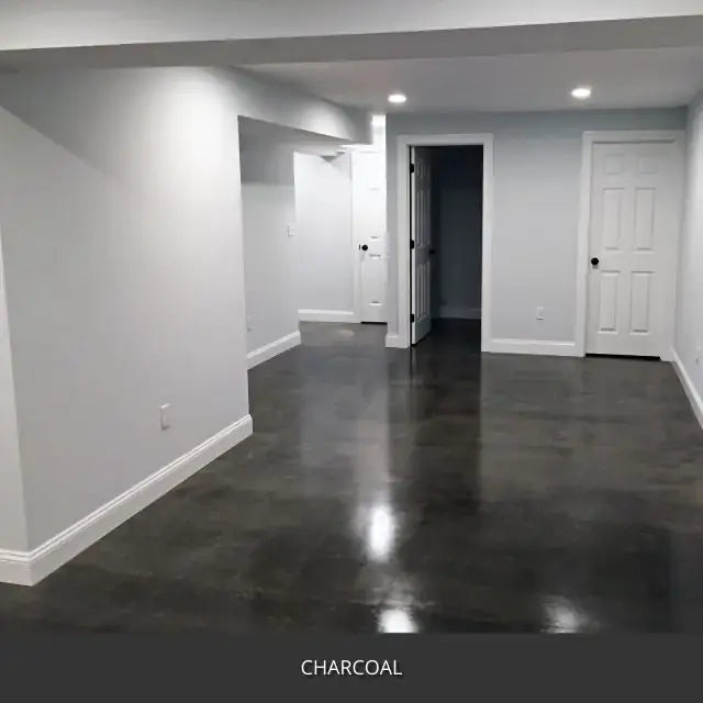 Sealed concrete floor in an empty finished basement, AcquaTint™ PRO Colored Sealer in 506 Charcoal