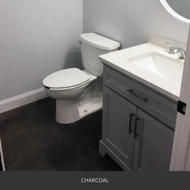 Sealed concrete floor in a bathroom with a vanity and toilet, AcquaTint™ PRO Colored Sealer in 506 Charcoal