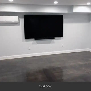 Sealed concrete floor in a basement media room with a wall mounted TV, AcquaTint™ PRO Colored Sealer in 506 Charcoal