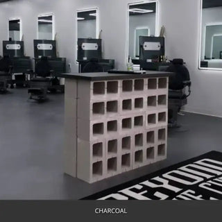 Sealed concrete floor in a barber shop with mirrors and a block partition, AcquaTint™ PRO Colored Sealer in 506 Charcoal