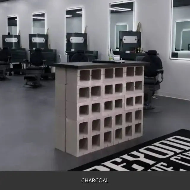 Sealed concrete floor in a barber shop with mirrors and a block partition, AcquaTint™ PRO Colored Sealer in 506 Charcoal