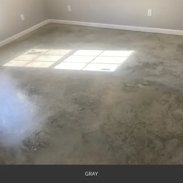 Marbled sealed concrete floor in an empty room with sunlight, AcquaTint™ PRO Colored Sealer in 515 Gray