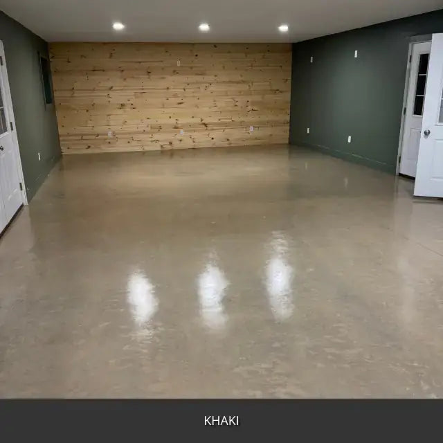 Sealed concrete floor in a room with a wood accent wall, AcquaTint™ PRO Colored Sealer in 516 Khaki