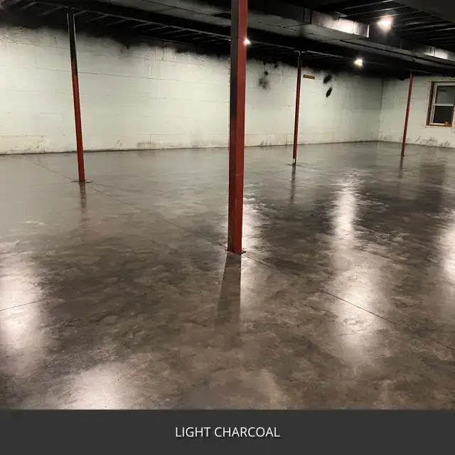 Sealed concrete floor in an unfinished basement with steel posts, AcquaTint™ PRO Colored Sealer in 517 Light Charcoal