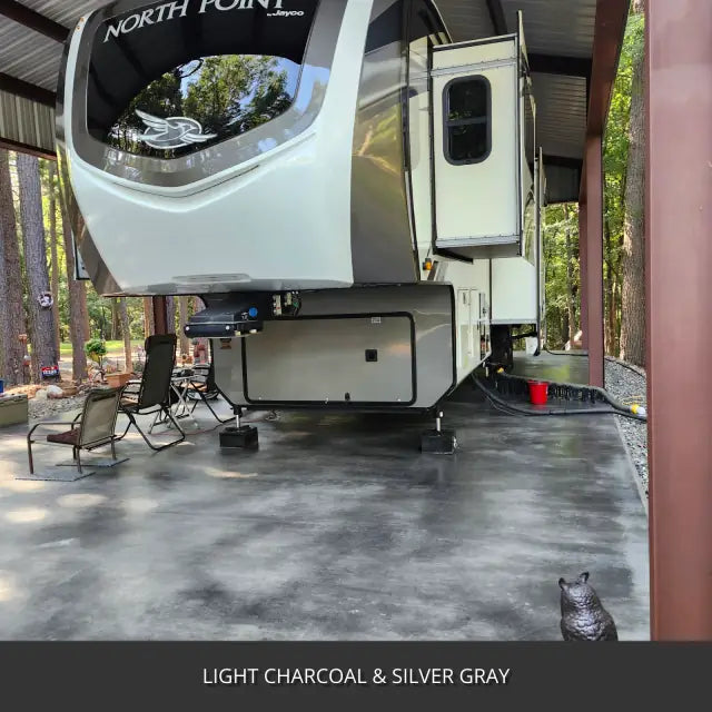 Sealed concrete slab under an open pole barn with a travel trailer, AcquaTint™ PRO Colored Sealer in Light Charcoal and Silver Gray