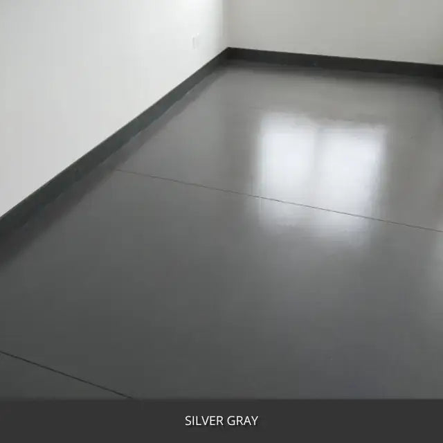 Sealed concrete floor along a dark wall with a gloss finish, AcquaTint™ PRO Colored Sealer in 524 Silver Gray