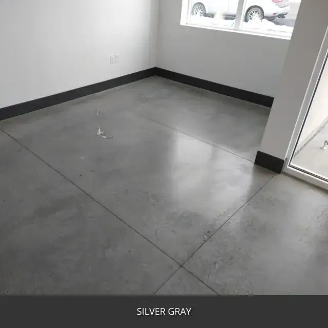 Sealed concrete floor in an empty room with a window, AcquaTint™ PRO Colored Sealer in 524 Silver Gray