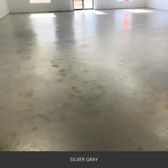 Sealed concrete floor in an empty room with a window, AcquaTint™ PRO Colored Sealer in 524 Silver Gray