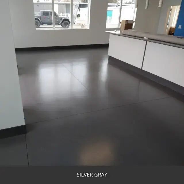 Sealed concrete floor in a retail or office space with a counter, AcquaTint™ PRO Colored Sealer in 524 Silver Gray