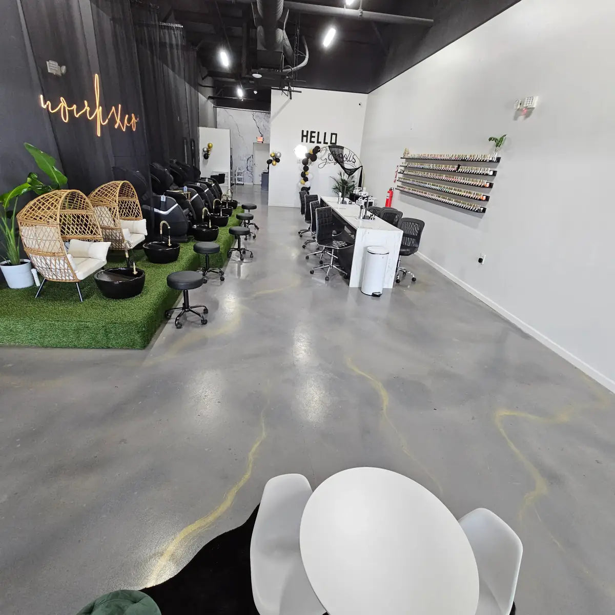 Sealed concrete floor in a hair salon with styling stations, AcquaTint™ PRO Colored Sealer in 524 Silver Gray