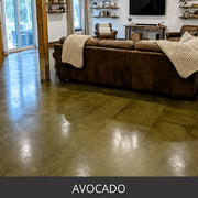 Acid stained concrete floor in a living room with a leather sofa, EverStain™ Acid Stain in AVO Avocado