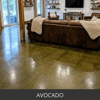Acid stained concrete floor in a living room with a leather sofa, EverStain™ Acid Stain in AVO Avocado