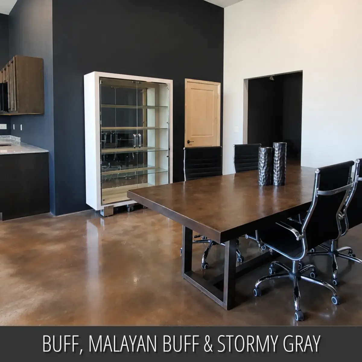 Dyed concrete floor in an office with a conference table, Vibrance™ Concrete Dye in Buff, Malayan Buff and Stormy Gray