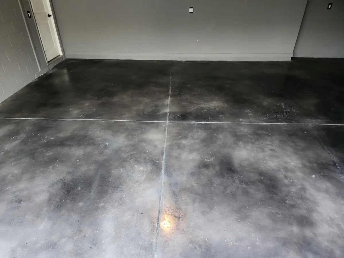 Dyed concrete garage floor with a faux polished finish, Vibrance™ Concrete Dye in Charcoal, Stormy Gray and White