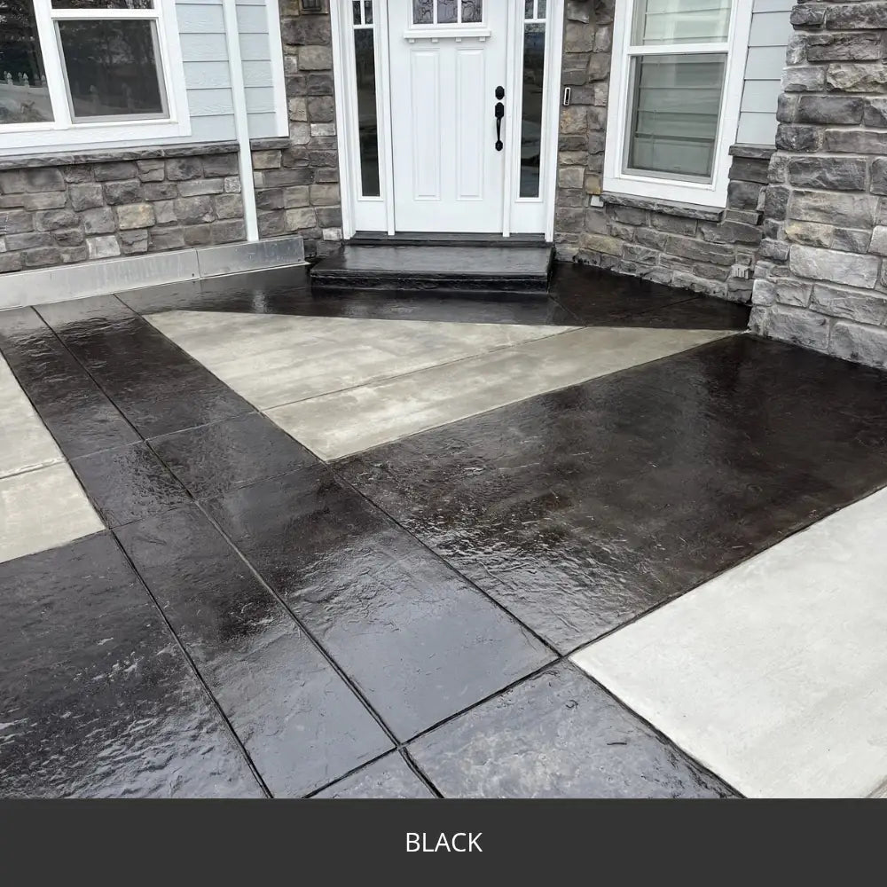 Sealed concrete entry walkway with a contrasting border at a stone house, EasyTint™ Tinted Concrete Sealer in 503 Black
