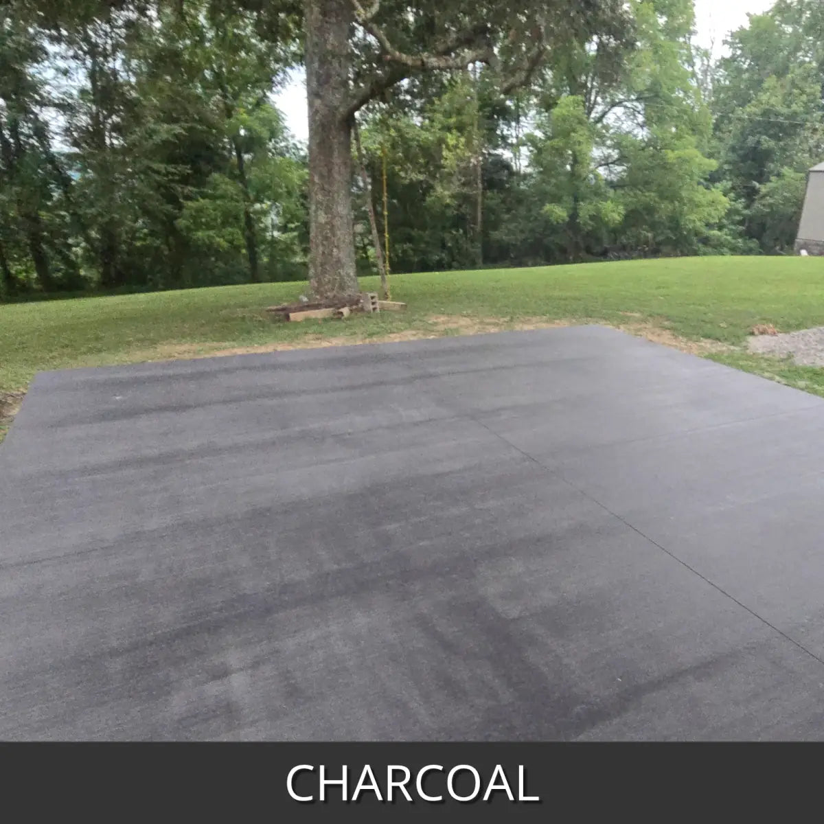 Sealed concrete driveway crossing a lawn, EasyTint™ Tinted Concrete Sealer in 506 Charcoal