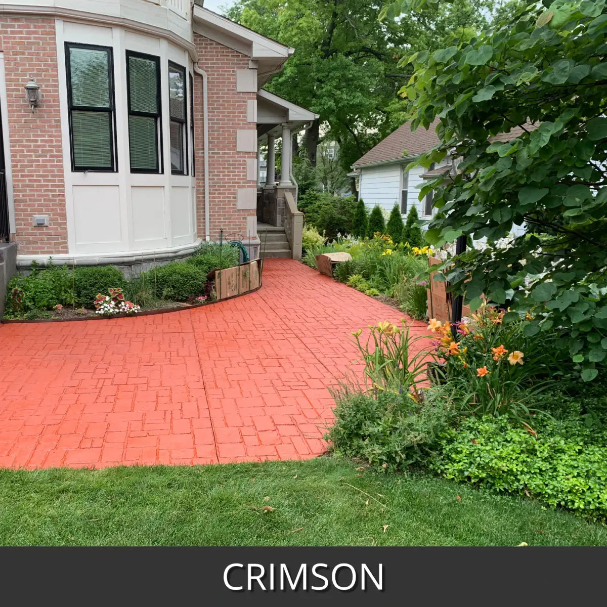 Stamped concrete walkway in a brick pattern beside a lawn, EasyTint™ Tinted Concrete Sealer in 509 Crimson