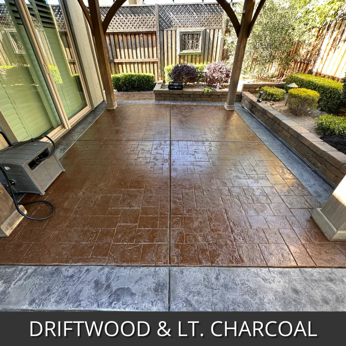 Stamped concrete patio in a courtyard with a contrasting border, EasyTint™ Tinted Concrete Sealer in Driftwood and Light Charcoal