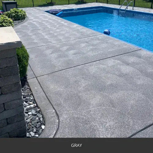 Sealed concrete pool deck along a rectangular pool, EasyTint™ Tinted Concrete Sealer in 515 Gray