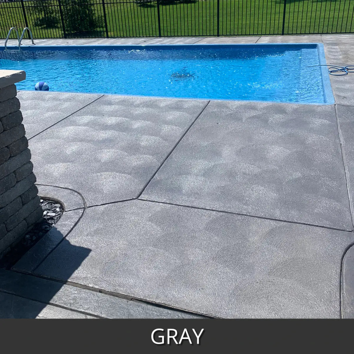 Sealed concrete pool deck along a rectangular pool, EasyTint™ Tinted Concrete Sealer in 515 Gray