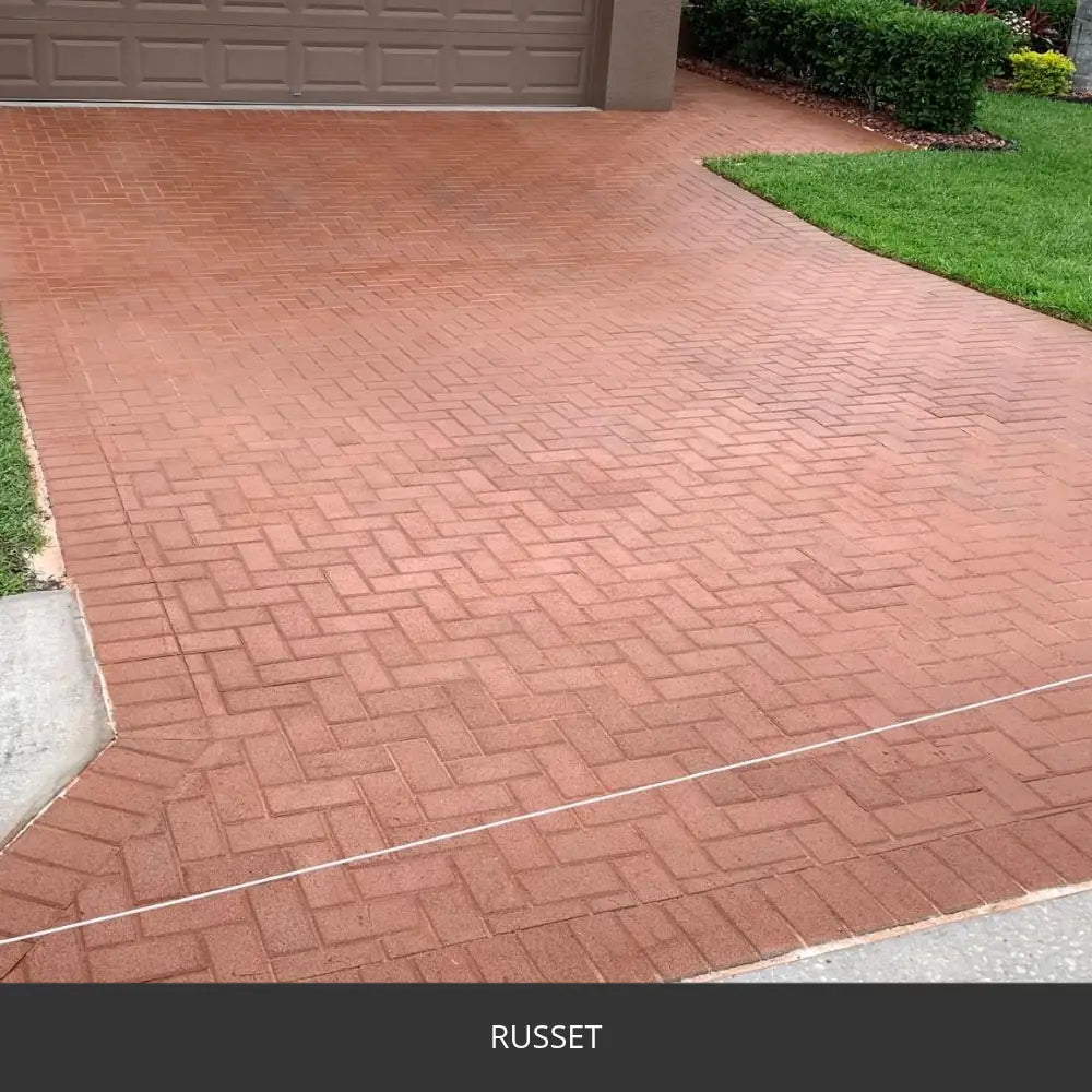 Stamped concrete driveway in a herringbone brick pattern, EasyTint™ Tinted Concrete Sealer in 523 Russet