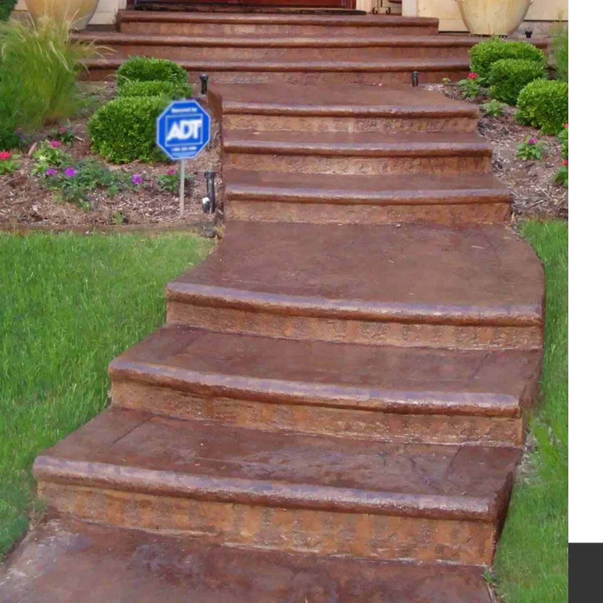 Sealed concrete steps down a landscaped slope, EasyTint™ Tinted Concrete Sealer in 528 Tweed