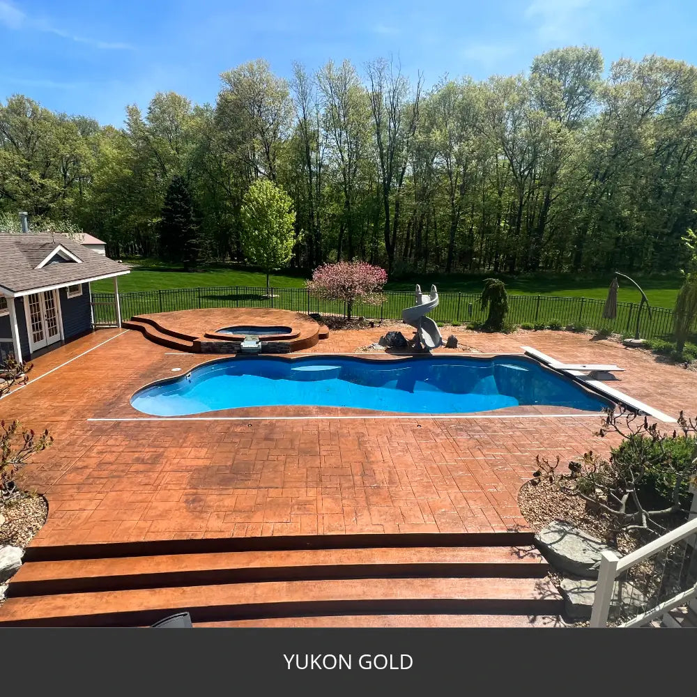 Stamped concrete pool deck with steps around a pool, EasyTint™ Tinted Concrete Sealer in 530 Yukon Gold
