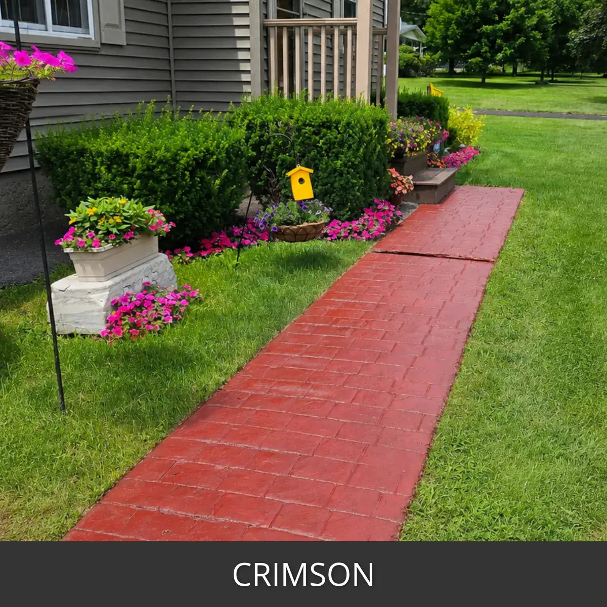 Stained paver walkway crossing a lawn past a flower bed, Portico™ Paver Stain in 709 Crimson