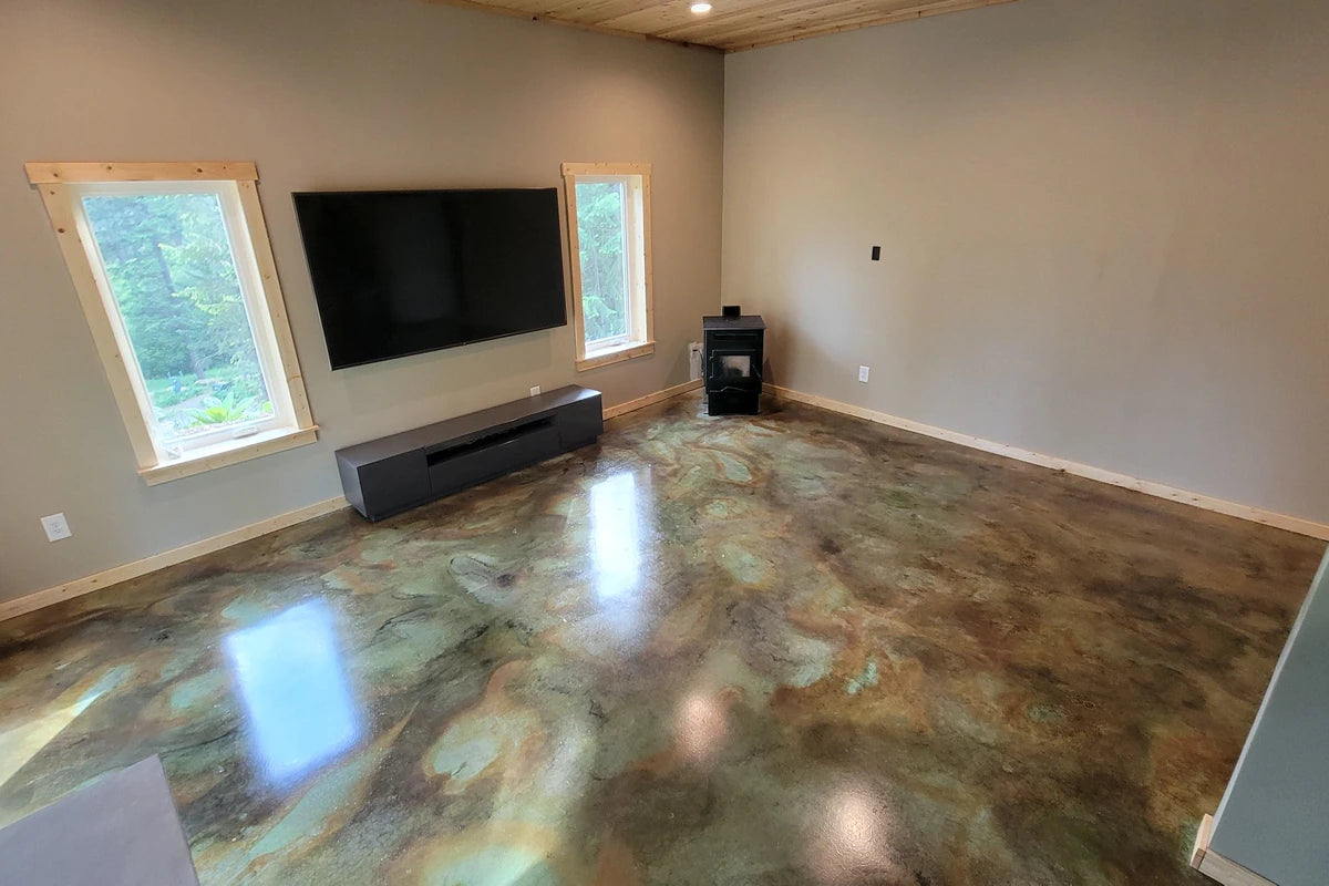 Acid stained concrete living room floor with a high gloss finish, EverStain™ in Azure Blue, Black and Malayan Buff sealed with AcquaSeal™ Gloss and finished with ProWax Polish™ Gloss