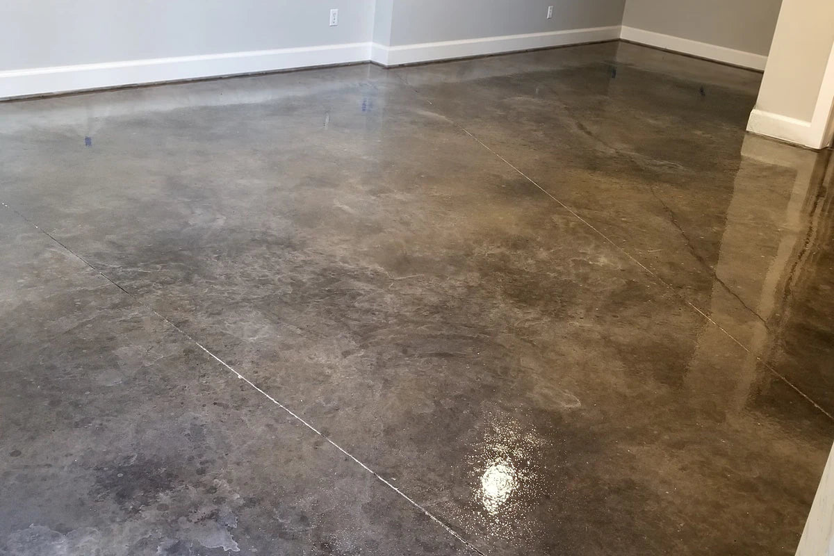Dyed concrete basement floor with a high gloss finish, Vibrance™ in 332 Driftwood and 335 Stormy Gray sealed with AcquaSeal™ Gloss and finished with ProWax Polish™ Gloss