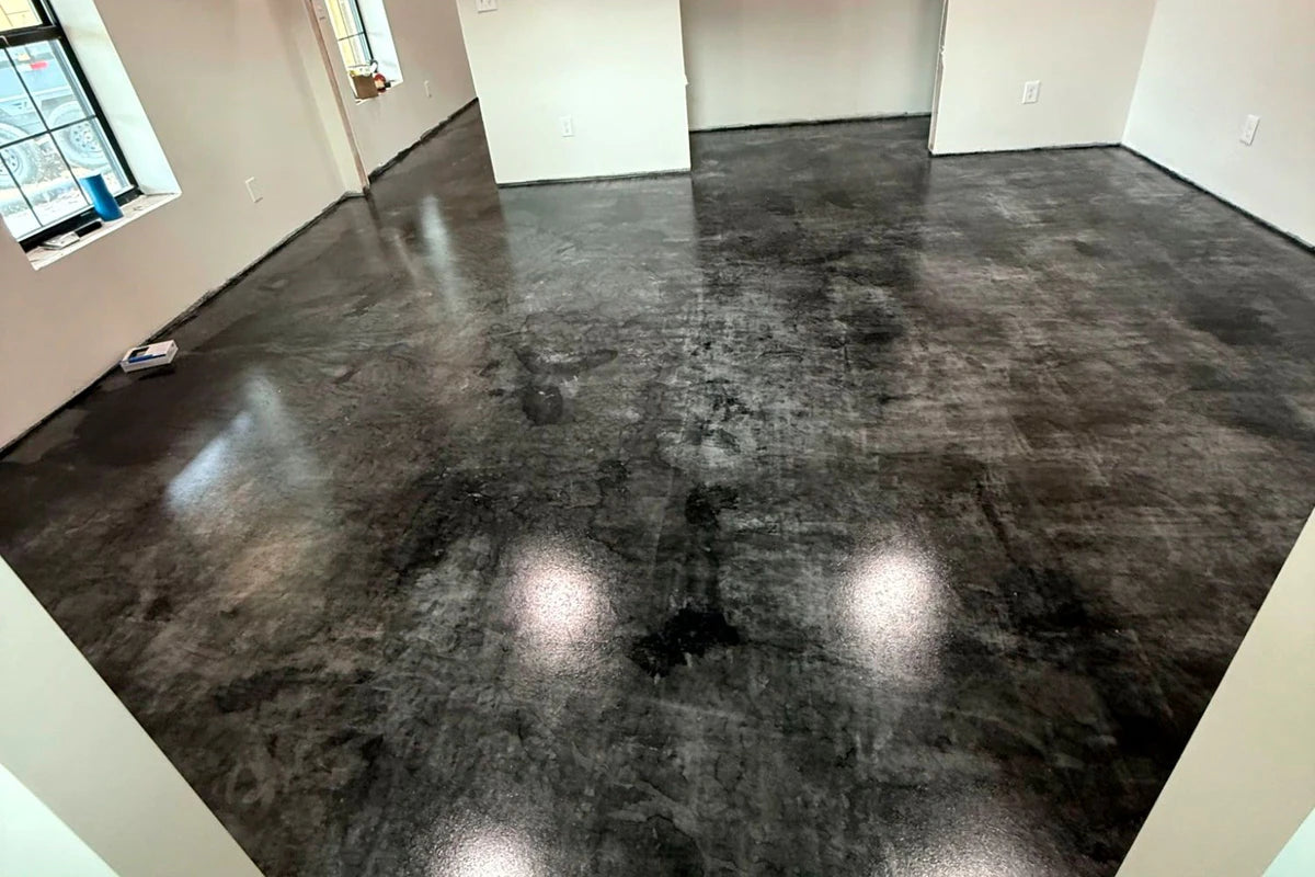 Stained concrete floor in a newly built home, ColorWave® in 606 Black sealed with AcquaSeal™ Satin and finished with ProWax Polish™ Satin