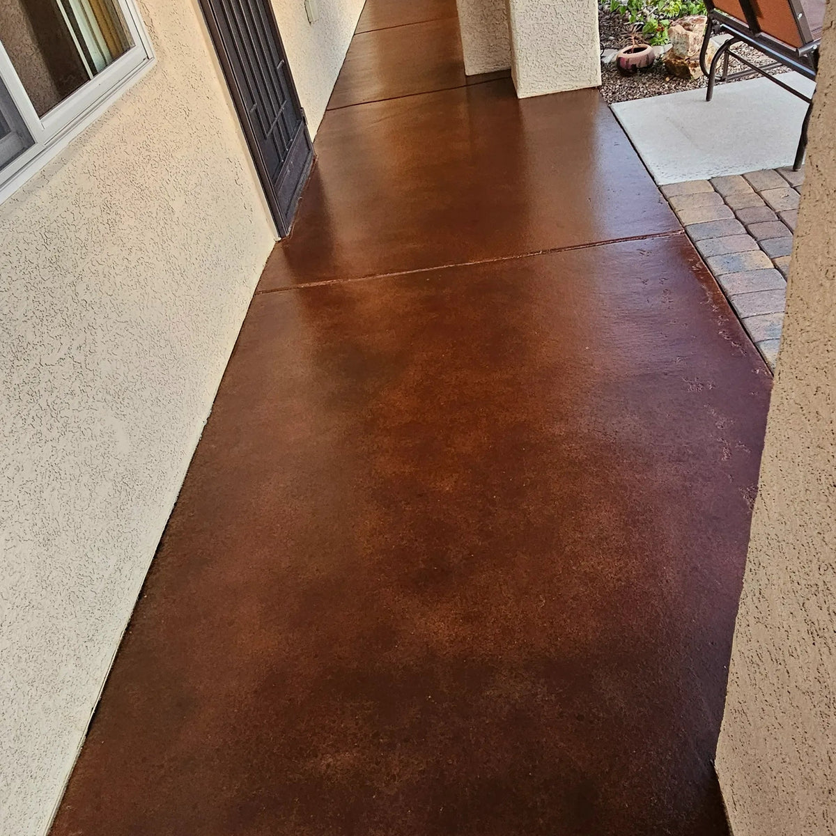 Concrete finished with AcquaTint™ Colored Sealer, Aztec Brown + Cumin