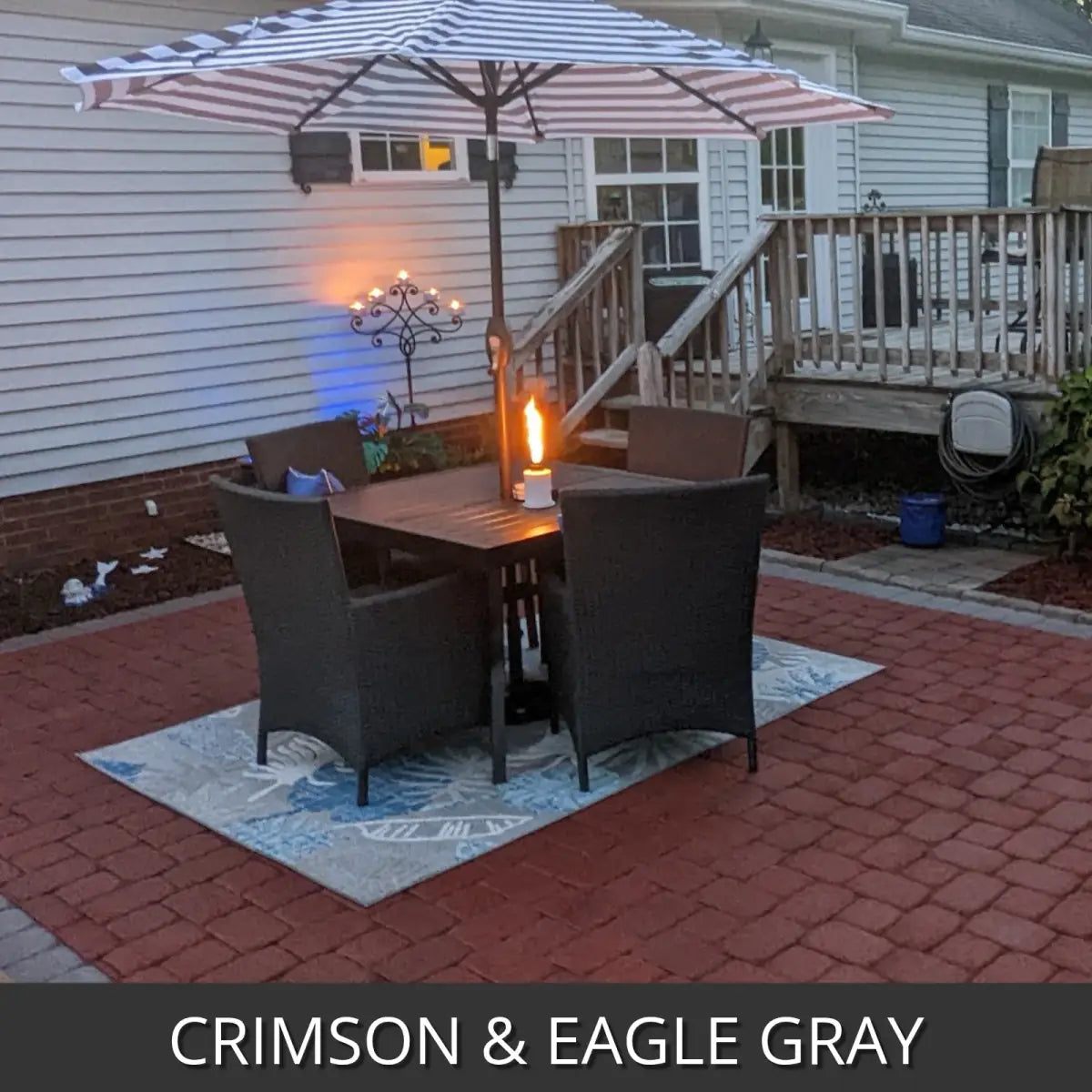 Stained paver patio with a fire table and outdoor dining set at dusk, Portico™ Paver Stain in 709 Crimson and 731 Eagle Gray
