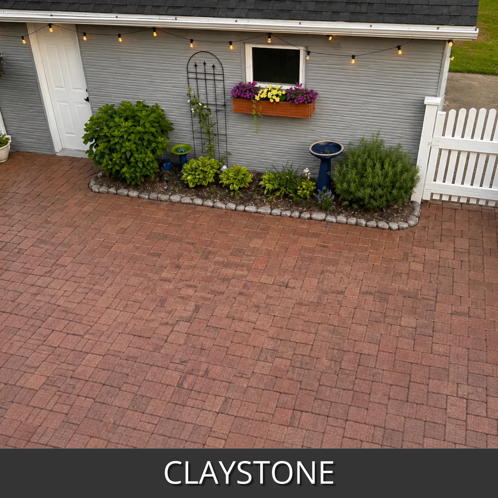 Charming backyard patio with cozy lights refinished with PaveWave claystone color
